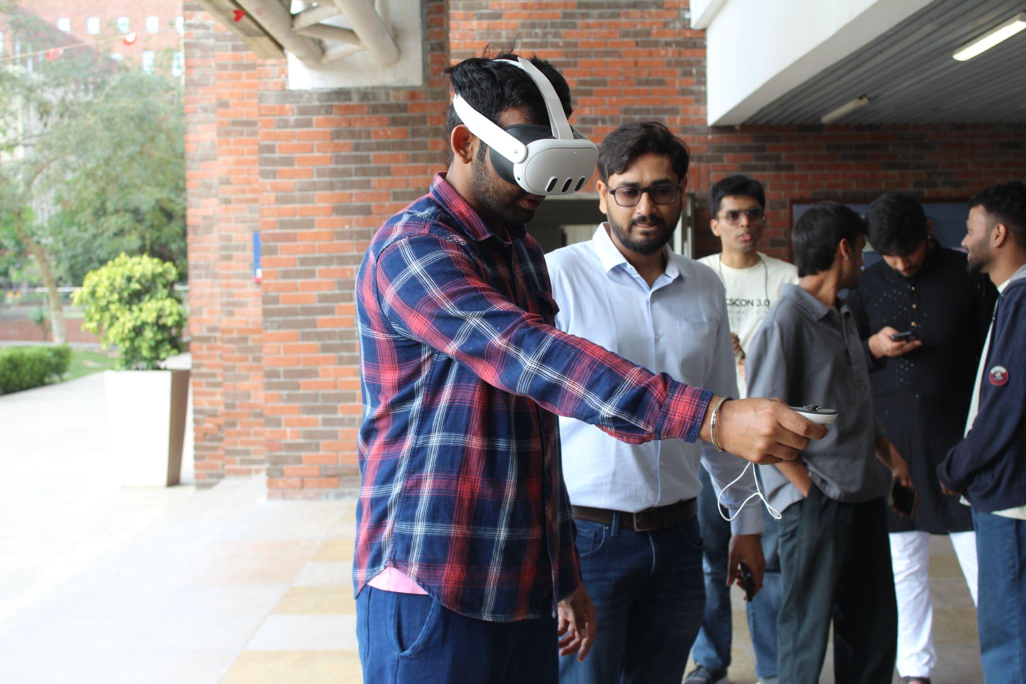 Students trying VR headsets at the WiCSCon 3.0 Technology Showcase